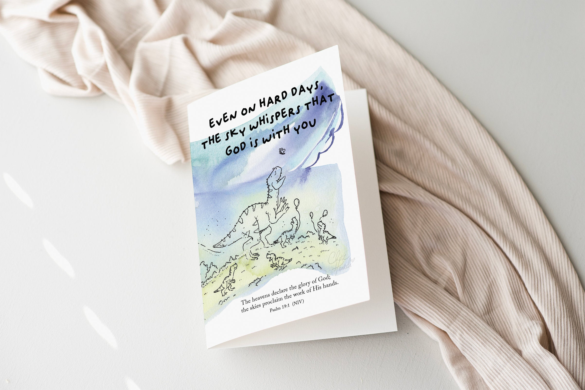 ChezHemdi dino greeting card with ‘The Sky Whispers That God Is With You’ verse – Christian encouragement stationery from The Commandment Co