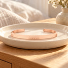 Child of God Classic Verse Band displayed on a ceramic tray in a warm lifestyle setting