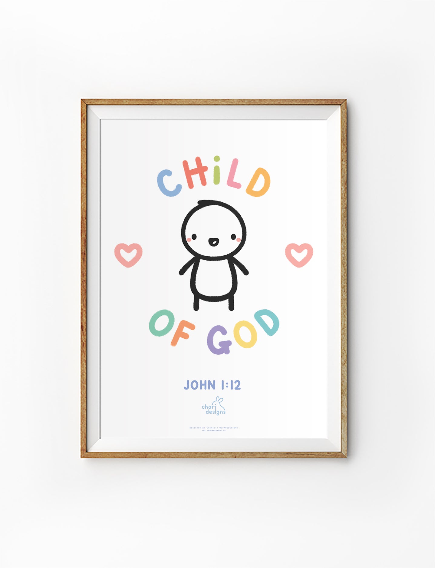 Child of God John 1:12 Christian nursery wall art print featuring cute illustrated child with pastel lettering and hearts, faith-based baby room decor, collaboration with Chari Designs.