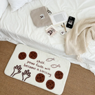 Cream rug with playful illustrations of loaves, fish, and hands, featuring the message "Child, your faith will become a blessing," placed beside a cozy bed, inspiring faith and simple happiness in a Christian home from Jincha God.