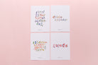 Set of four Chinese calligraphy Christian scripture cards with colorful brush lettering on pastel background.
