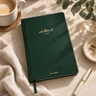 Chokmah Christian planner styled on a desk with coffee, eucalyptus and stationery in warm natural light.