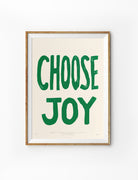 Choose Joy Christian poster inspired by Philippians 4:4 in a natural wood frame on a white background