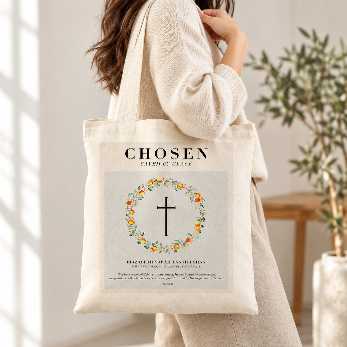 Chosen Saved by Grace customisable Christian baptism tote bag carried in a bright neutral interior.