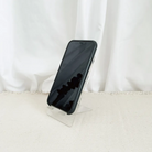 Faith-based phone stand with a phone displayed on the stand.