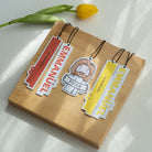 Faith-based air fresheners featuring 'Emmanuel God With Us' and 'Peace & Joy' in vibrant colors