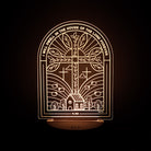 Christian LED lamp featuring an arch window design with a cross, a house, trees, and the verse from Psalm 23:6: 'I will dwell in the house of the Lord forever.'