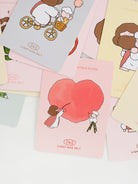 Close-up of a Christian mini card with a heart illustration and cute Jesus design, part of an encouragement card set