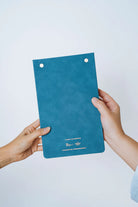 Back view of The Project J Christian notepad in blue, featuring a soft textured cover and special collaboration details, perfect for uplifting and faith-inspired daily planning.
