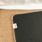 Cream rug with the words "We love, because he first loved us. 1 John 4:19" placed on a mat by white curtains, bringing faith and simple happiness to any Christian home from Jincha God.