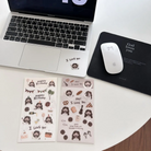 Laptop with "I Love You" Jesus sticker, two Christian sticker sheets, and a "God loves you" mouse pad and mouse on a white desk, inspiring encouragement and simple happiness.