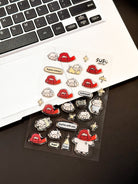 Cute Christian stickers on laptop featuring kawaii Jesus and sheep with Bible verse phrases like rejoice always and hallelujah