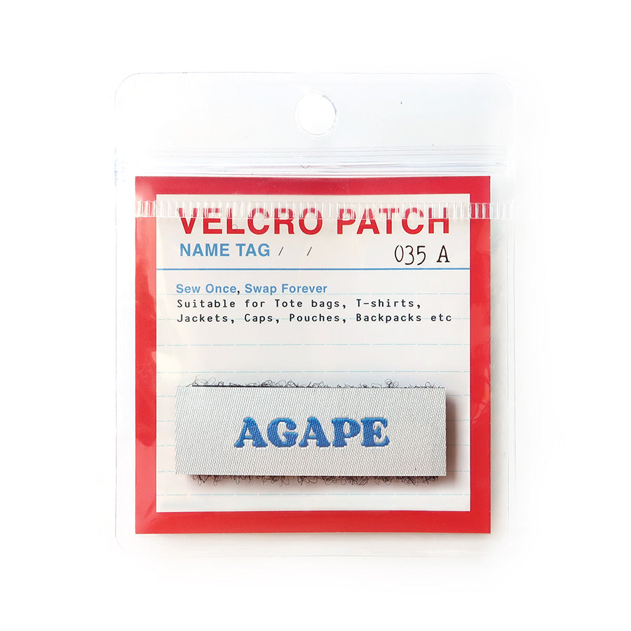 Velcro tag with the word 'Agape' in blue text on a white background, representing Christian love and faith for use on clothing and accessories