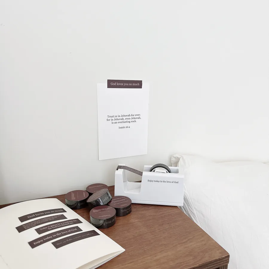 Christian washi tapes with encouraging messages like “God loves you so much” and Bible verses, displayed on a wooden table with a journal, from The Commandment Co Singapore.