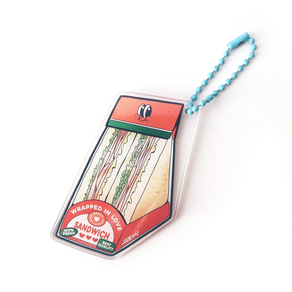 Christian keychain featuring a sandwich design with the message 'Wrapped in Love' and scripture reference Jude 1:2, perfect for faith-inspired gifts.