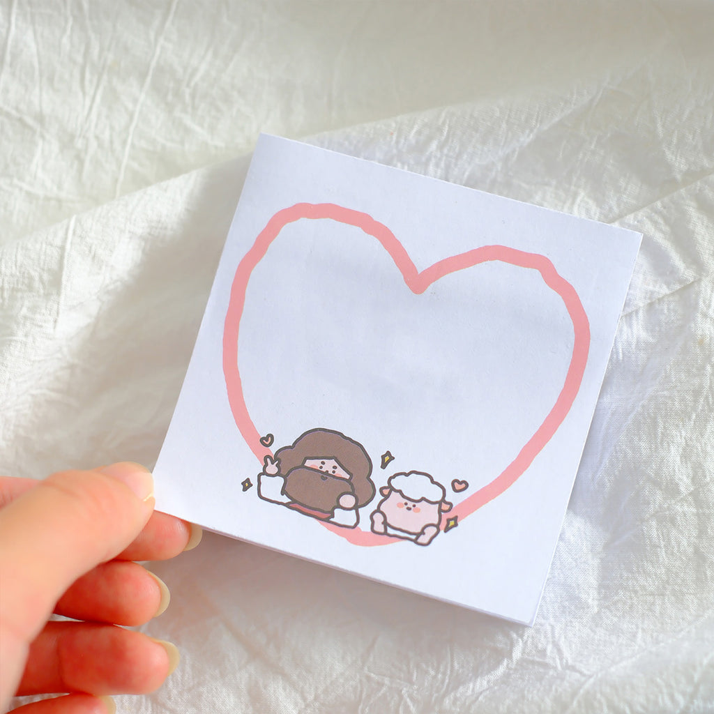 Sticky note featuring a pink heart illustration surrounding Jesus and a sheep with cheerful expressions, designed for Christian-themed stationery.