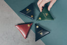 Contemporary Christian leather coin wallet with compact profile.