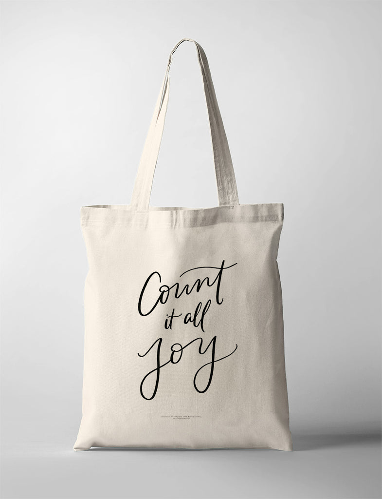 Simple canvas tote bag featuring the motivational text 'Count it all Joy' in calligraphy.