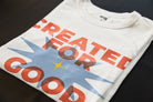 Close-up of the “Created for Good Works” Christian t-shirt print with orange typography, blue graphic detail, and Ephesians 2:10 verse reference.