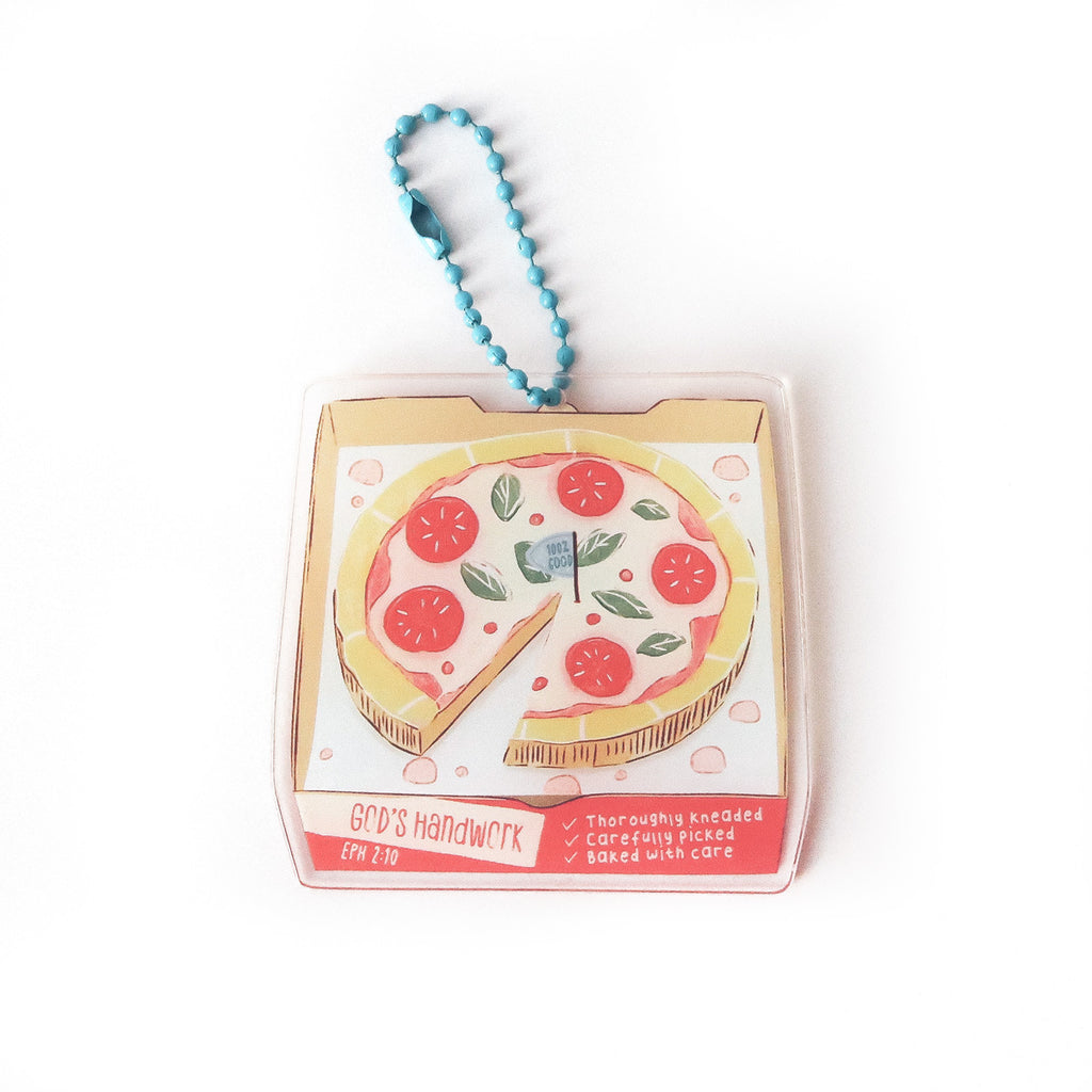 Faith-inspired keychain featuring a pizza illustration with the text ‘God’s Handwork’ and Ephesians 2:10, symbolizing care and purpose.