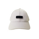 A beige cap featuring a customizable black velcro patch that allows for interchangeable designs, offering a versatile and modern faith-based streetwear accessory.