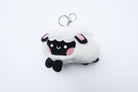 Three faith-inspired Lil Sheepies plush keychains in White Cumulus, Pink Hana, and Stormy Gray are displayed on a white background. Each soft, fluffy sheep represents a reminder of the Good Shepherd’s love, featuring a Bible verse charm, a retractable string for easy card access, and a secure keychain clip. Perfect as a Christian gift or daily faith companion.