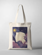 Canvas tote bag with Dita illustration of a white dove flying in a starry night sky holding a glowing star, symbol of peace and hope