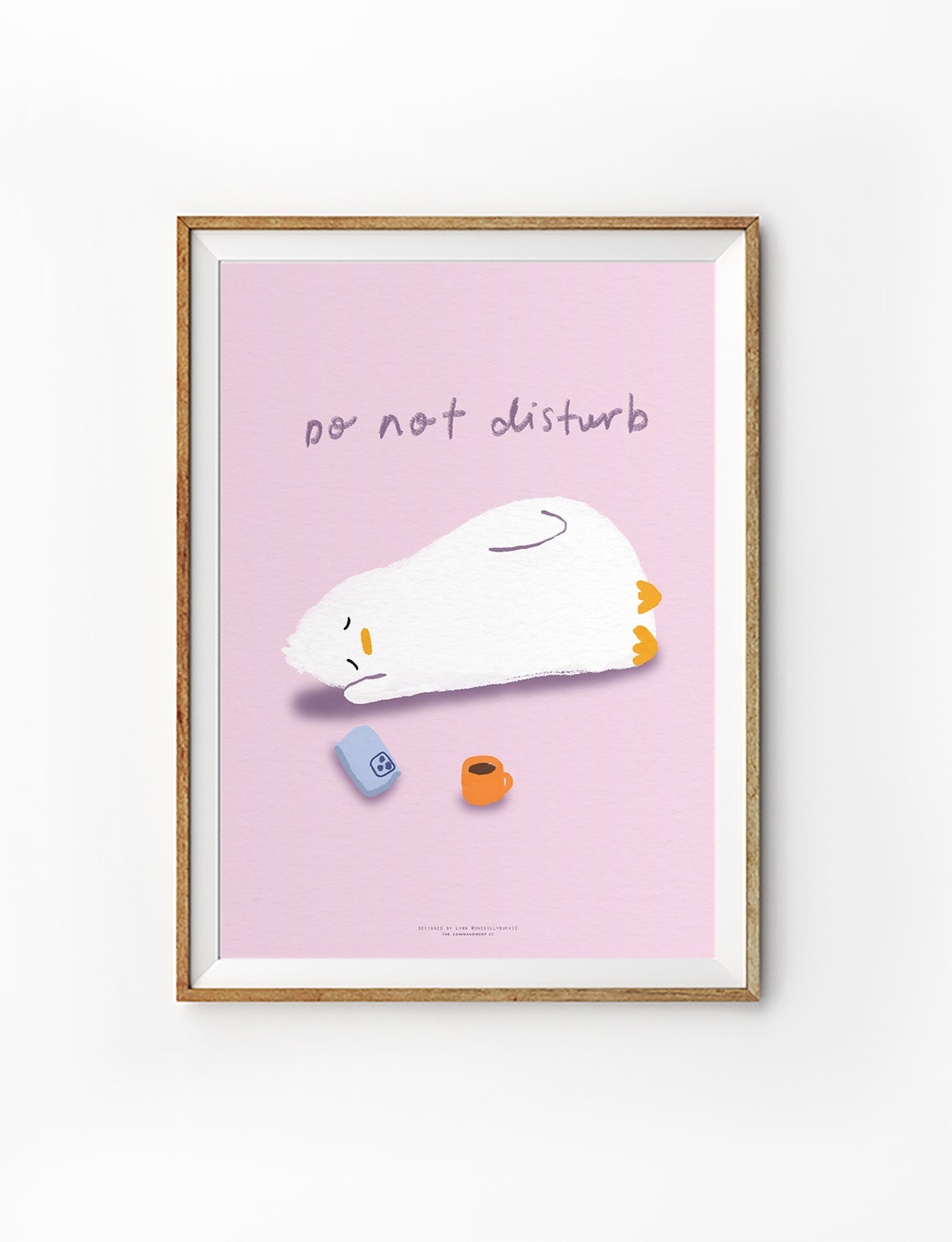 Do Not Disturb Christian wall art featuring a resting duck on a soft pink background, illustrated by Onesillyduckie in collaboration with The Commandment Co, symbolising rest and stillness in God