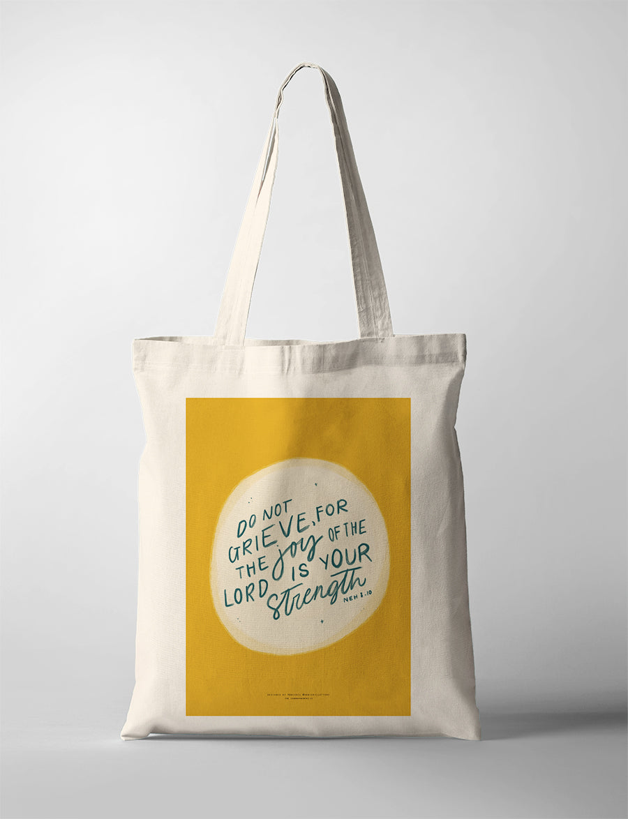 Christian tote bag featuring Nehemiah 8:10, “Do not grieve, for the joy of the Lord is your strength”