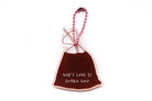 Front view of Singapore drink bag-inspired Christian acrylic keychain featuring “God’s Love Is Extra Gao” with pink ball chain