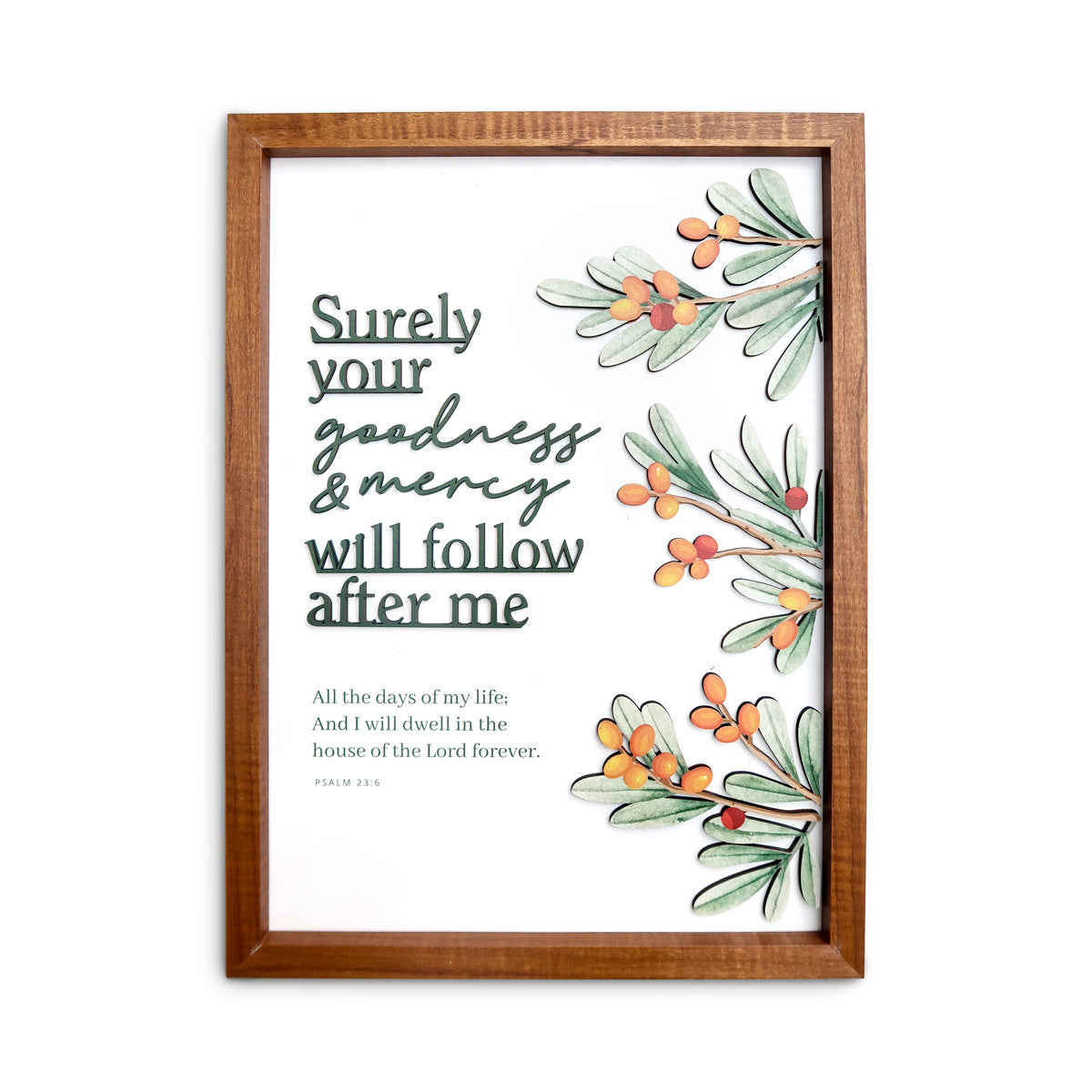 A wooden-framed wall art featuring the scripture "Surely your goodness and mercy will follow after me" from Psalm 23:6, accompanied by delicate illustrations of green leaves and orange berries, perfect for Christian-inspired home decoration.