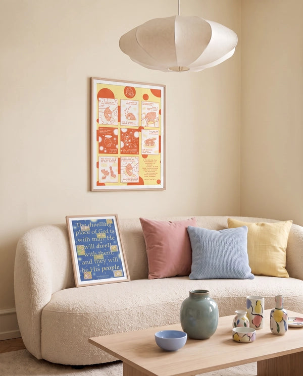 Dwelling Place of God blue Revelation 21:3 Christian poster displayed leaning on a cream sofa in a warm living room with pastel cushions