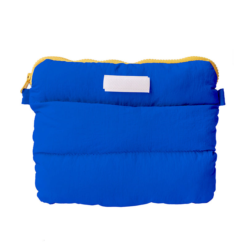 Electric Blue Pong Pong Bag, a versatile multi-purpose bag with a bright yellow zipper, designed for style and functionality.