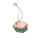 Baby Jesus in a manger Christmas bauble with the word ‘Emmanuel’.