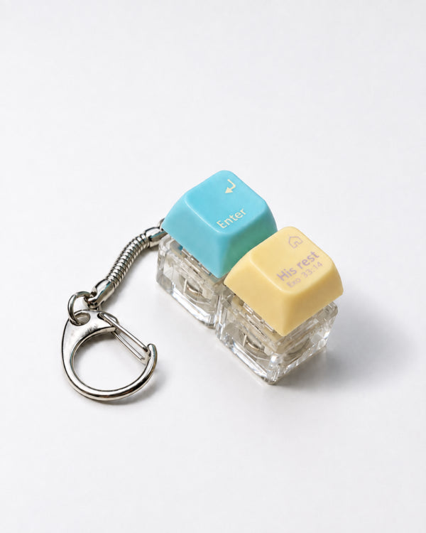 Enter His Rest double light-up keycap keychain with blue and yellow keys on a white background