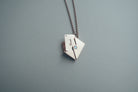 Envelope Locket necklace detail showing its personalised metal insert.