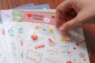 Close-up of everyday believer love themed Christian sticker sheet featuring cute illustrations like hearts, envelopes, dove, and faith-inspired phrases about love