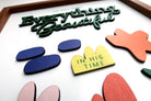 Close-up of a wooden scripture poster featuring the words "Everything Beautiful" and "In His Time" with colorful, handcrafted layered designs, perfect for inspirational and faith-based home decor.