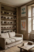 Everything In His Time poster displayed with Faith It Forward in a warm rustic living room