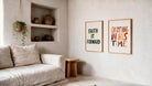 Everything In His Time poster beside Faith It Forward in a bright neutral living room