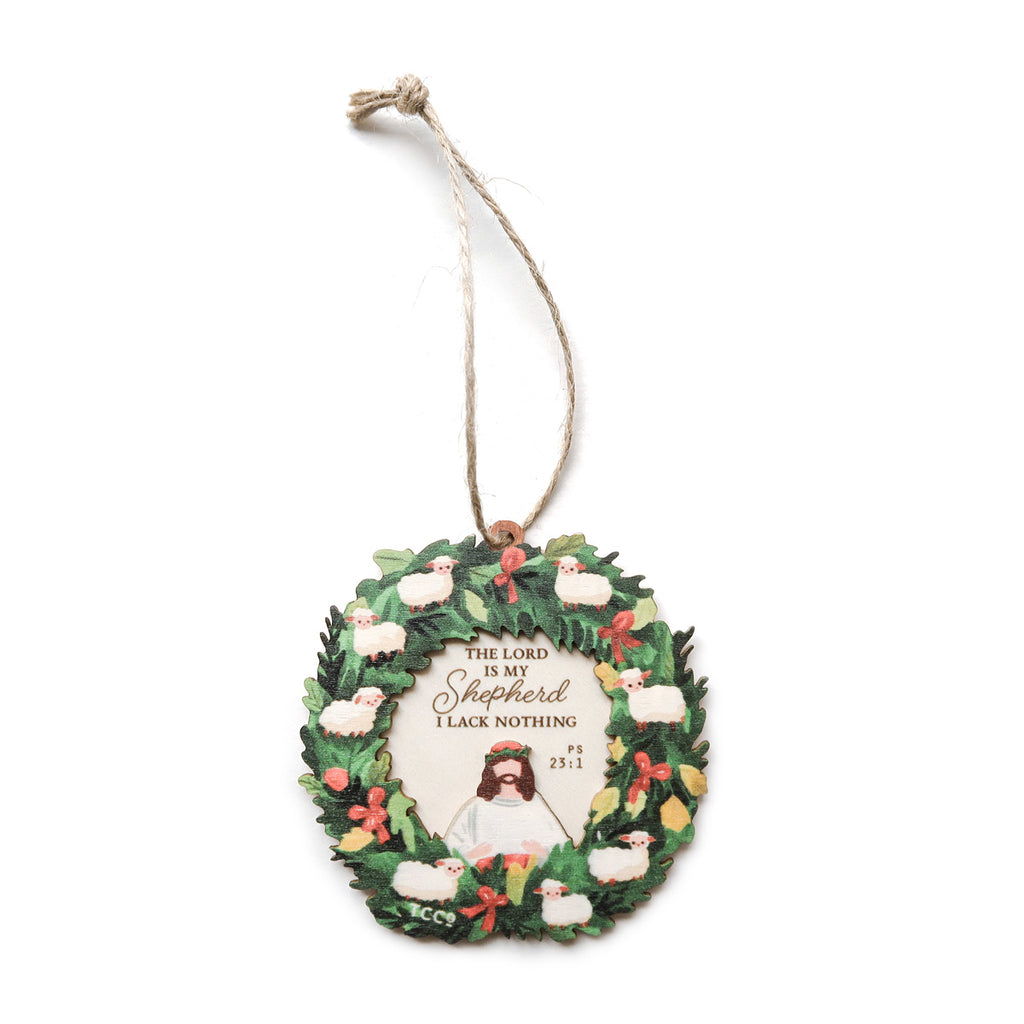 Christmas wreath ornament featuring the verse 'The Lord is My Shepherd, I Lack Nothing' from Psalm 23:1, adorned with lambs and festive decorations, perfect for faith-inspired holiday decor.