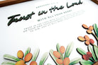 Close-up of a wooden board poster featuring the scripture "Trust in the Lord with all your heart" from Proverbs 3:5-6. The design includes layered text and decorative orange berries with green leaves.