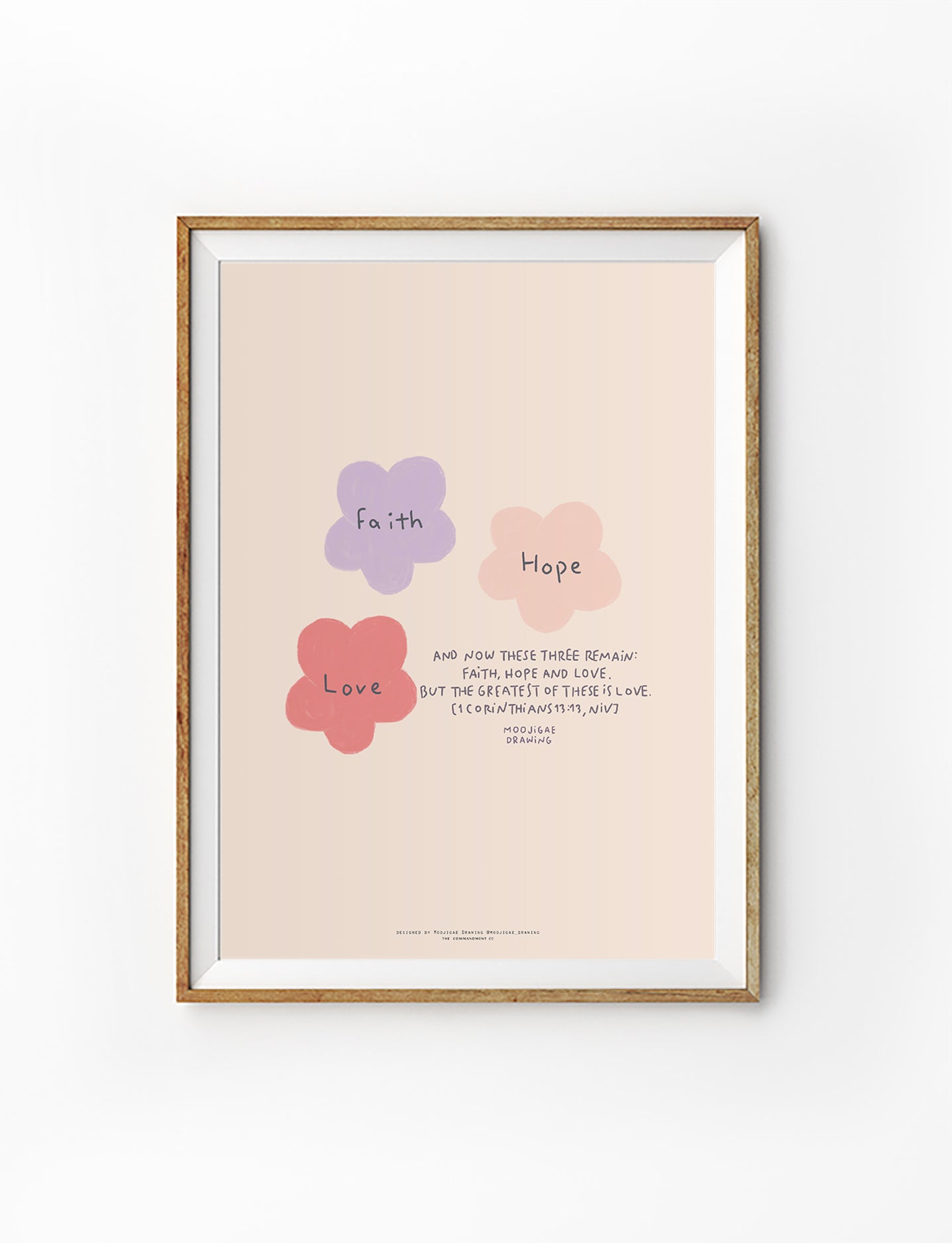 Christian wall art poster featuring pastel floral illustrations labelled “Faith,” “Hope,” and “Love,” inspired by 1 Corinthians 13:13, designed by Moojigae Drawing in collaboration with The Commandment Co.