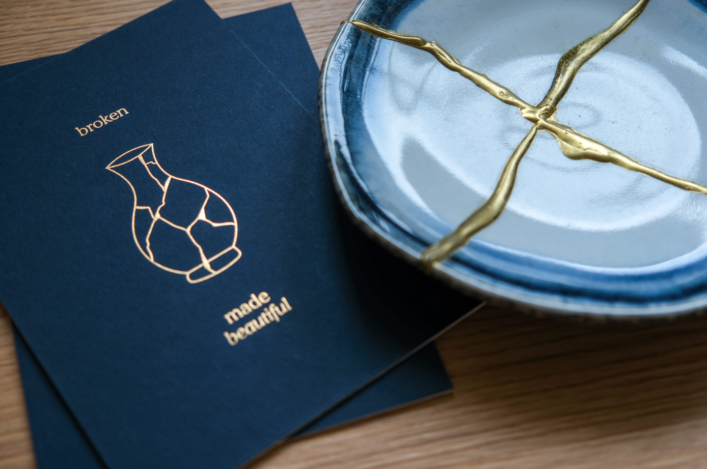 Faith-inspired letterpress print showing a broken vase made whole again, representing hope, restoration, and beauty in brokenness.