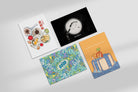 Flatlay of faith-inspired postcards including How Are You Today, God Is Still Here, The Good Fruit, and Happy Baptism Broski designs from The Commandment Co collaborations with Thir.st and HHM.