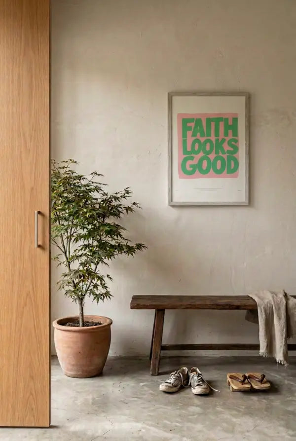 Faith Looks Good Christian poster displayed in a warm neutral entryway with a wooden bench