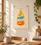 Faith Mustard Sauce small wall tapestry hanging with clips in a warm sunlit home interior.