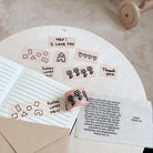 Hand-drawn Father Loves Me washi tape featuring Christian phrases, flowers and playful illustrations on a journal and Bible-inspired fabric
