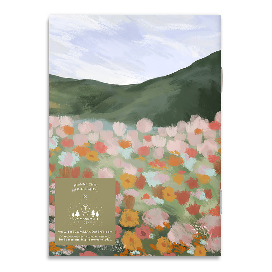 Illustrated back cover of Christian-inspired notebook with a floral scene, designed to encourage faith and devotion.