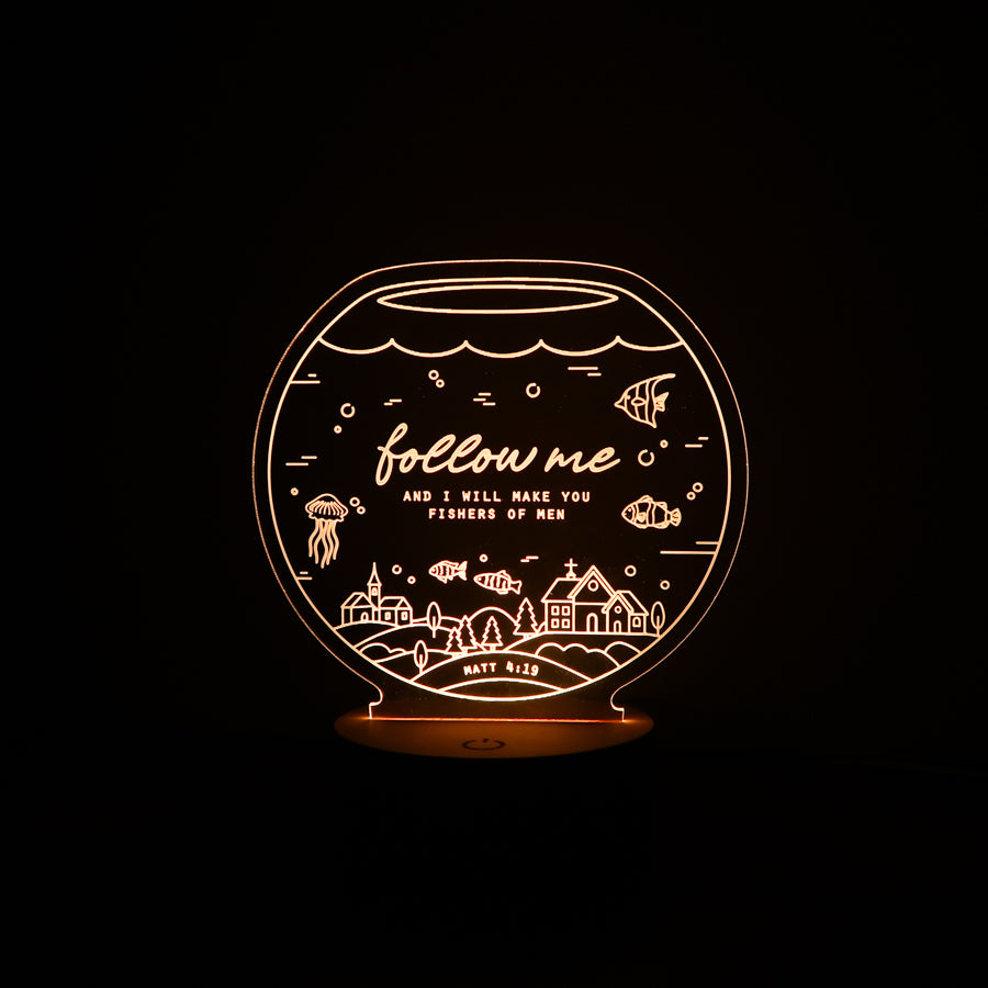 Christian night light with fishbowl design engraved with ‘Follow Me, and I Will Make You Fishers of Men’ from Matthew 4:19 – faith-inspired LED lamp from The Commandment Co